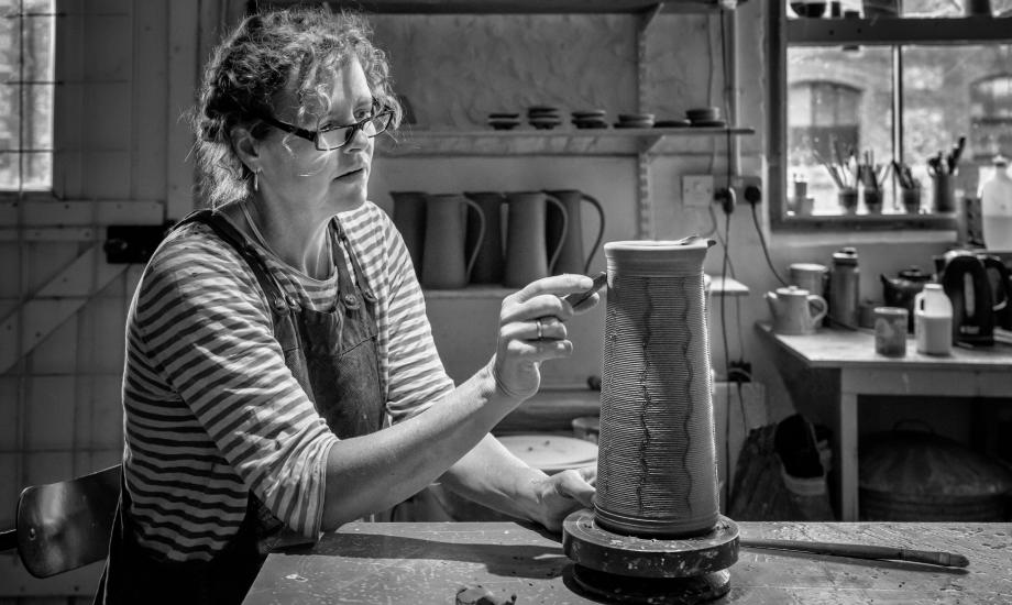 Jennie Gilbert scoring clay vase