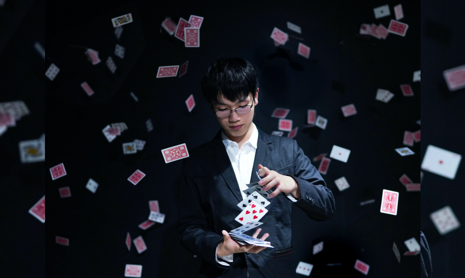 Magician with deck of cards
