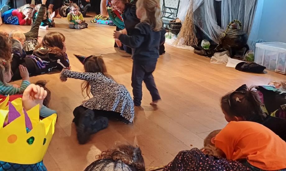 Children listening to stories with treehouse theatre