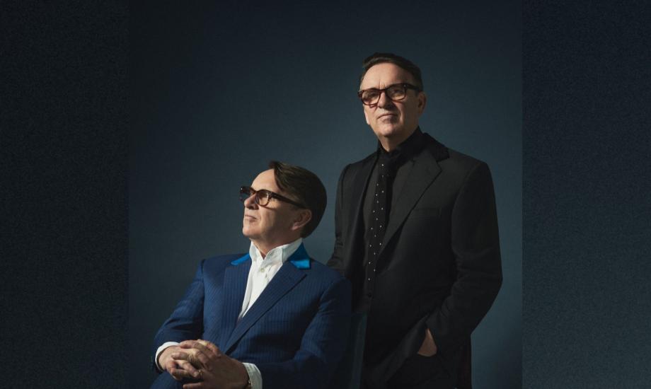 Chris Difford standing and Melvin Duffy seated