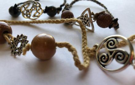 Image of 3 handmade celtic bracelets with metal celtic symbols