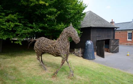 Willow war horse at Aldershot Military Museum. Created by artists Judith Needham in 2014